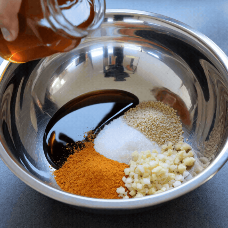 Honey pouring into bowl with ingredients